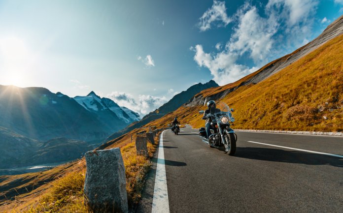 Motorcycle,Driver,Riding,In,Alpine,Highway,On,Famous,Hochalpenstrasse,,Austria,